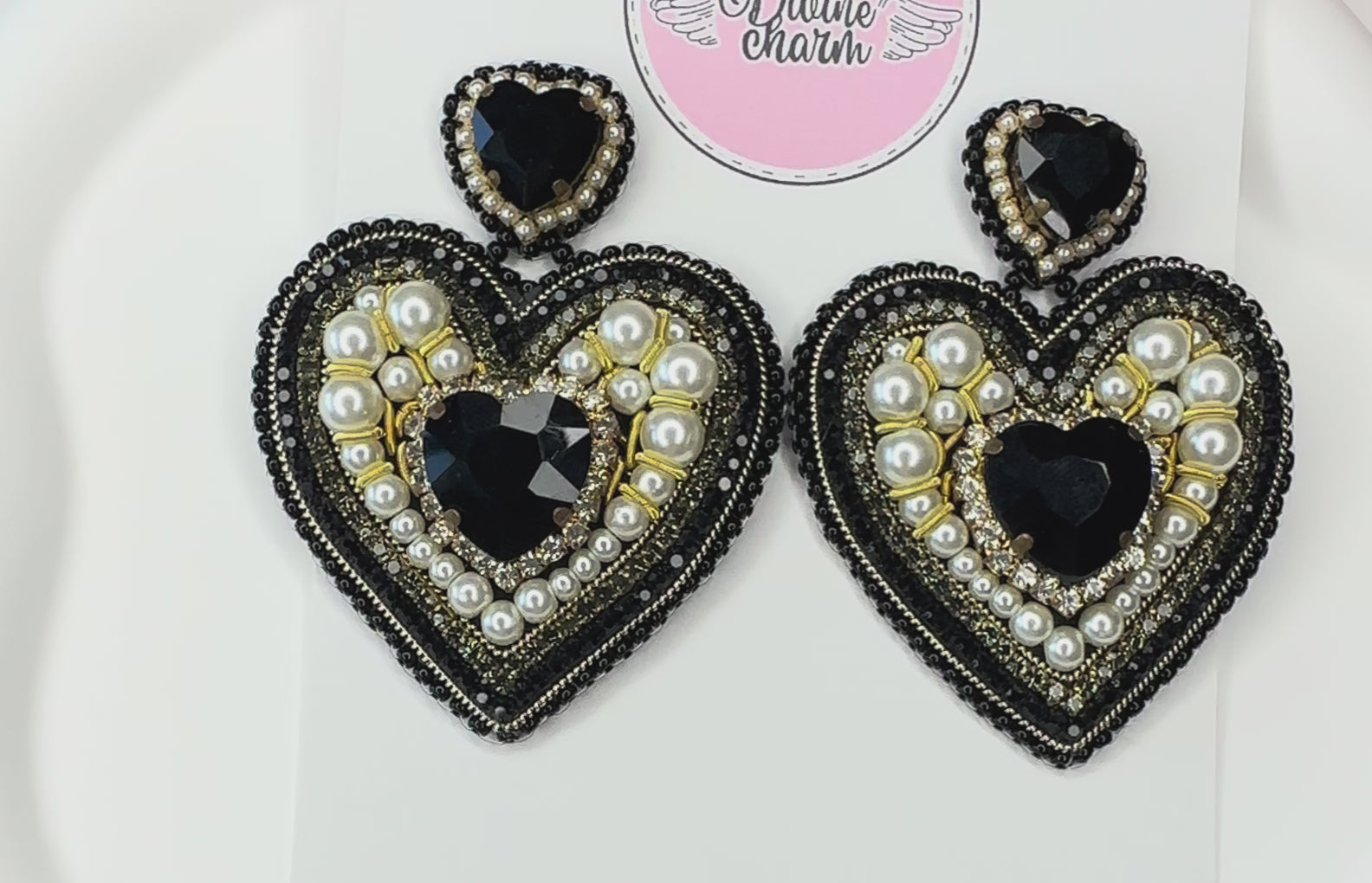 Load video: Crafted to dazzle, stitched to last.  Each pair is delicately hand-embroidered with crystals, sequins and vibrant colour because your earrings should reflect your sparkle.